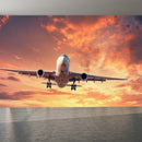 Airplane-In-The-Sky-At-Sunrise Wallpaper