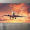 Airplane-In-The-Sky-At-Sunrise Wallpaper