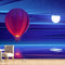 Air Balloon Flying Above Sea Water At Night