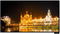 Glowing Golden Temple Night View Wallpaper